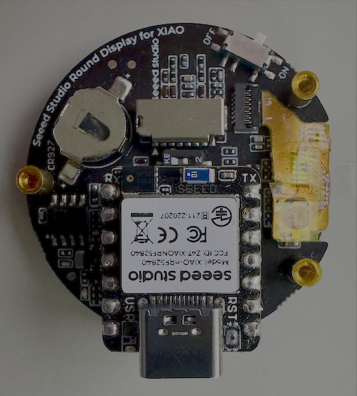 A XIAO nRF52840 board on the Seeed Studio Round Display.